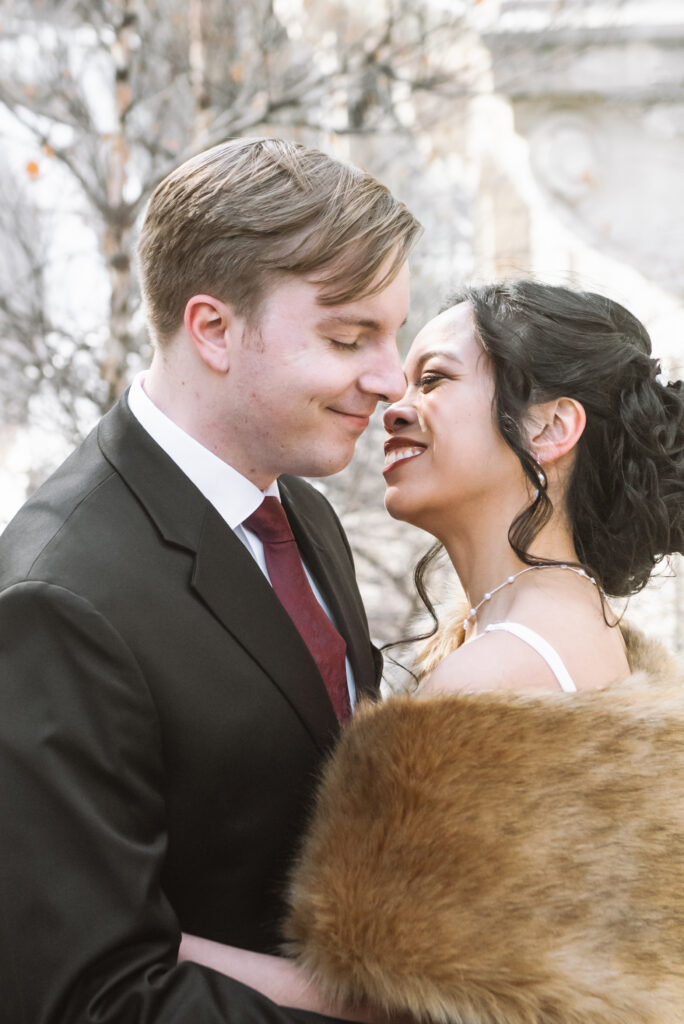 Close up portrait of couple going in for a kiss along Chicago's Riverwalk.